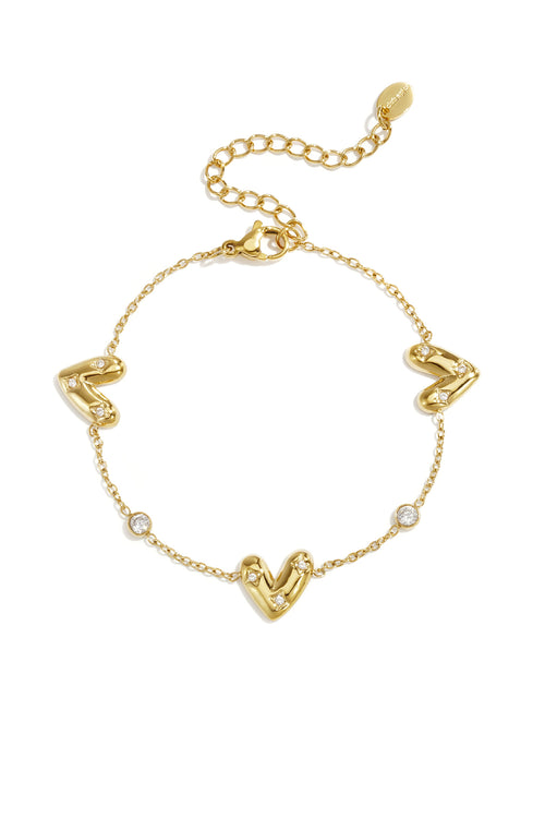Bracelet with three set hearts and round cubic zirconia stones