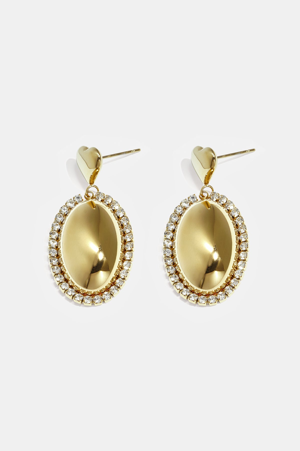 Statement earrings with an oval charm surrounded by stones